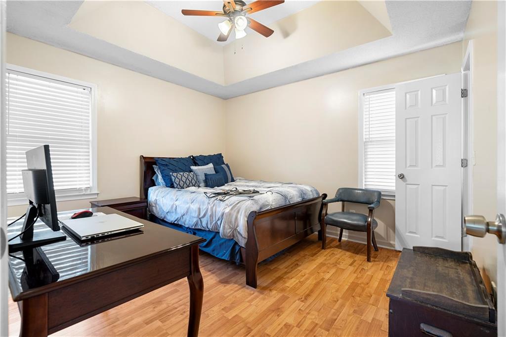 30 Azalea Drive Southeast Cartersville, GA 30121 - Photo 17 of 35 a bedroom with a bed and wooden floor