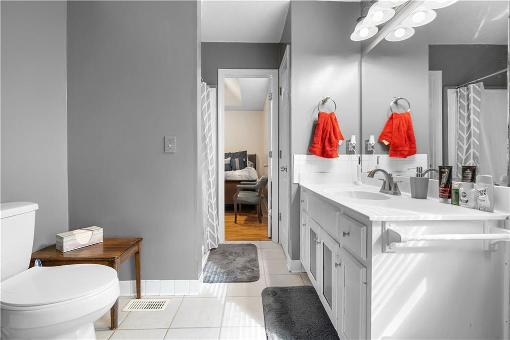 30 Azalea Drive Southeast Cartersville, GA 30121 - Photo 18 of 35 a en suite bathroom with a sink and a mirror