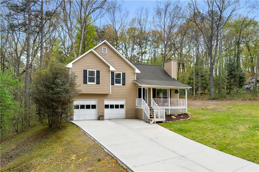 30 Azalea Drive Southeast Cartersville, GA 30121 - Photo 2 of 35 a front view of a house with a yard and trees