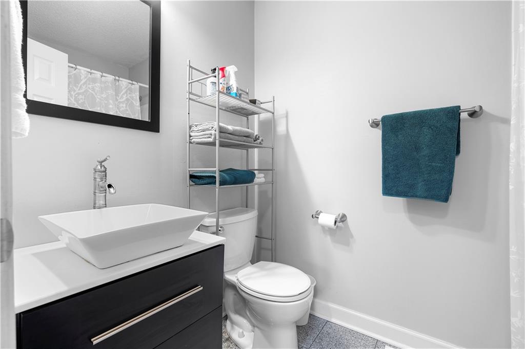 30 Azalea Drive Southeast Cartersville, GA 30121 - Photo 23 of 35 a bathroom with a sink a toilet and mirror