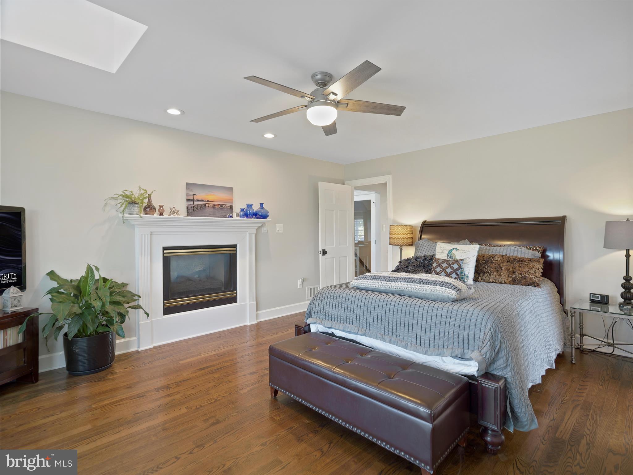 10306 Church Hill Road Myersville, MD 21773 - Photo 18 of 81 a bedroom with a bed and a fireplace