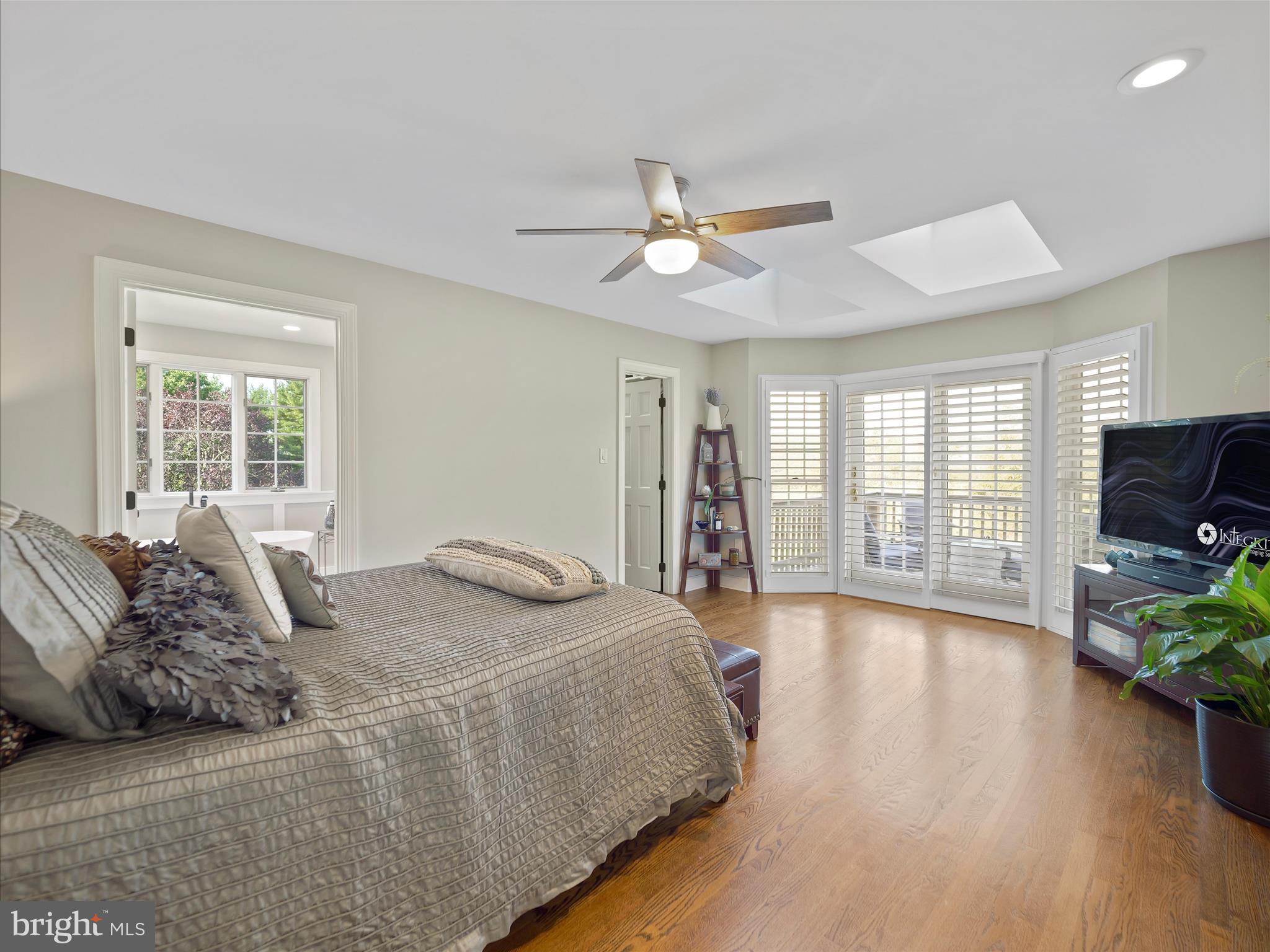 10306 Church Hill Road Myersville, MD 21773 - Photo 19 of 81 a bed sitting in a spacious bedroom next to a window