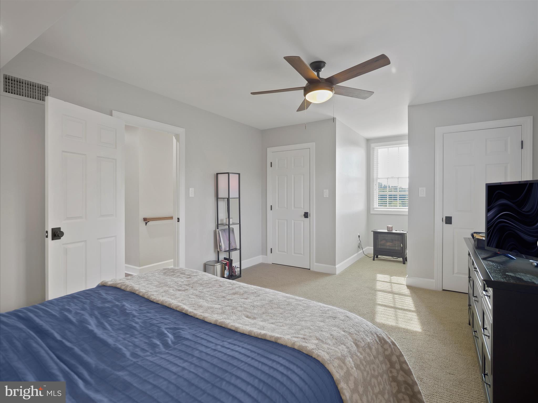 10306 Church Hill Road Myersville, MD 21773 - Photo 29 of 81 a bedroom with a bed and a flat screen tv