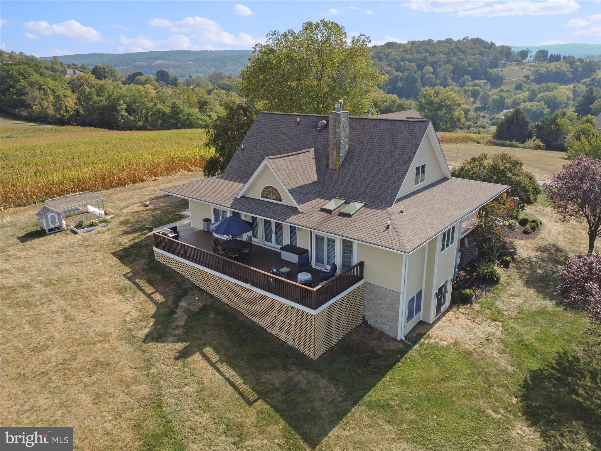 10306 Church Hill Road Myersville, MD 21773 - Photo 56 of 81 an aerial view of a house with a garden and lake view