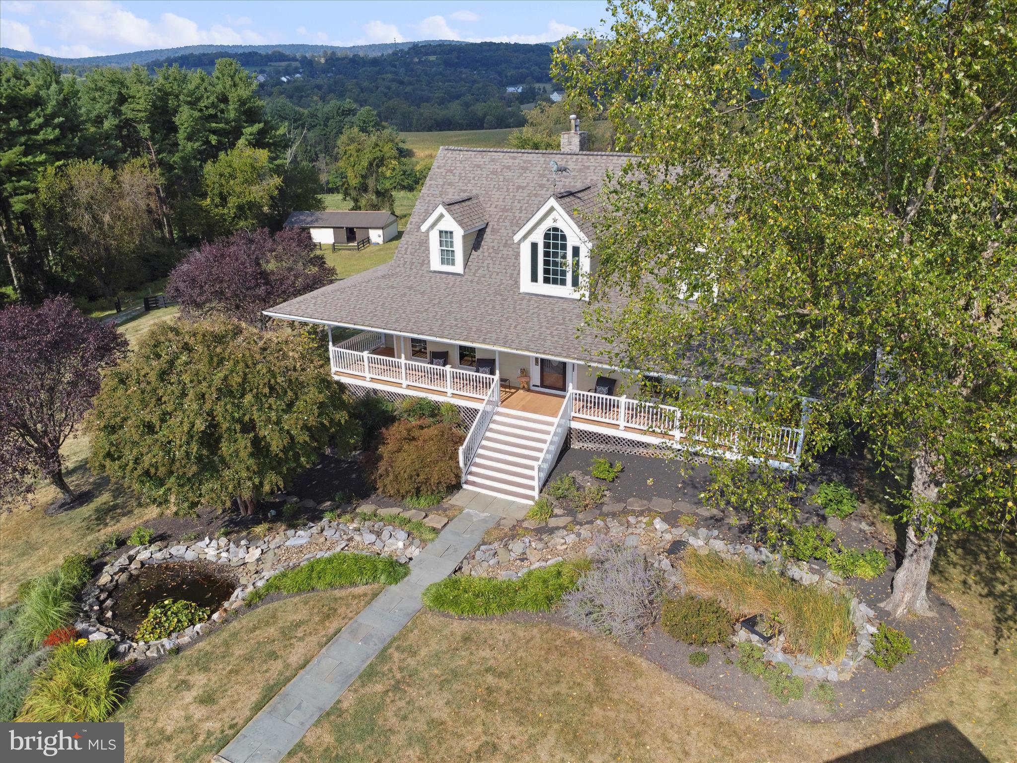10306 Church Hill Road Myersville, MD 21773 - Photo 66 of 81 an aerial view of a house with a yard and lake view