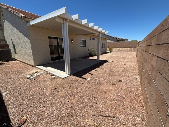 2866 Shimmering Bay Street Laughlin, NV 89029 - Photo 30 of 32 A spacious backyard awaits, featuring a covered patio for shaded outdoor enjoyment.