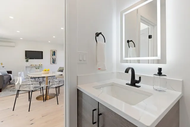 a bathroom with a sink and a mirror