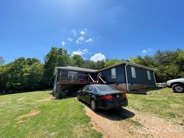 a view of a backyard with a car parked