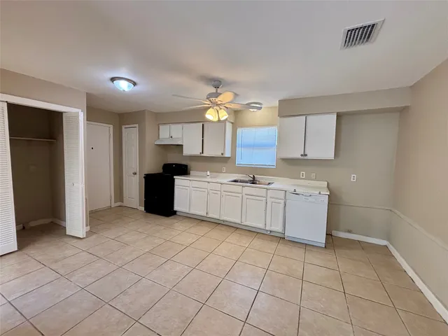 a view of a kitchen with electric appliances