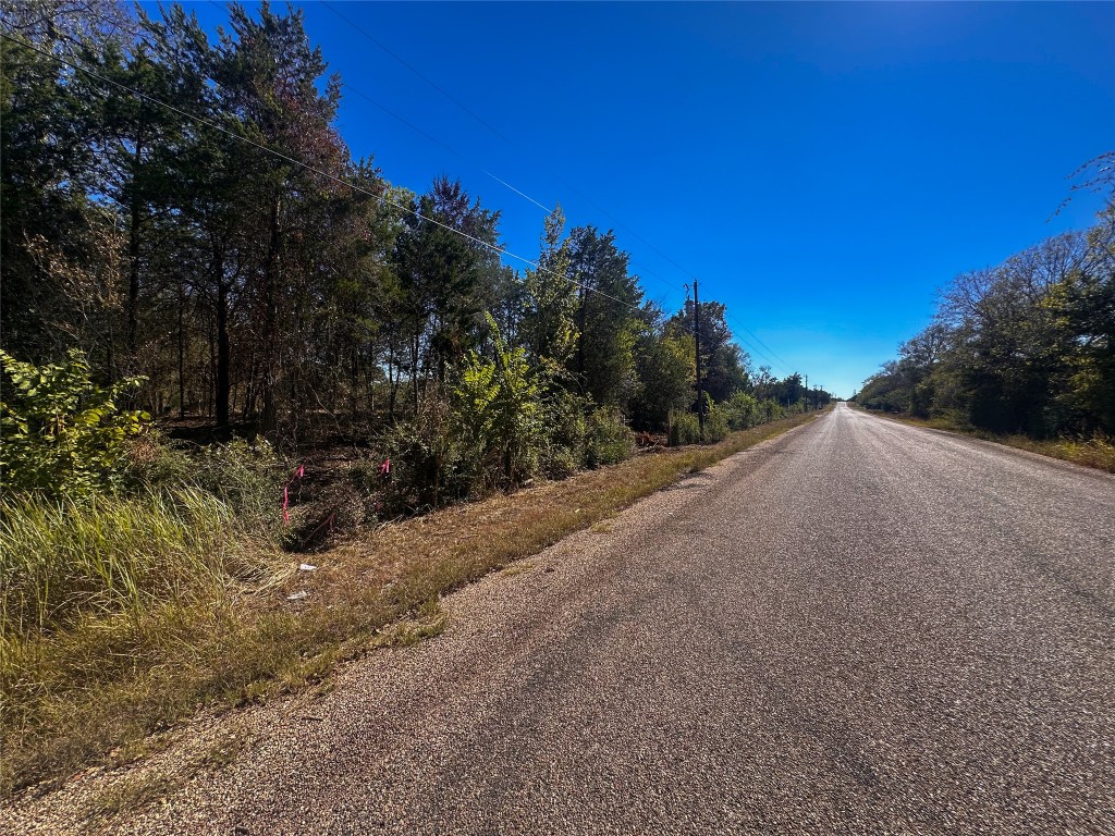 Lot 9 Foothill Road Bastrop, TX 78602 - Photo 4 of 12 a view of a road with a building in the background