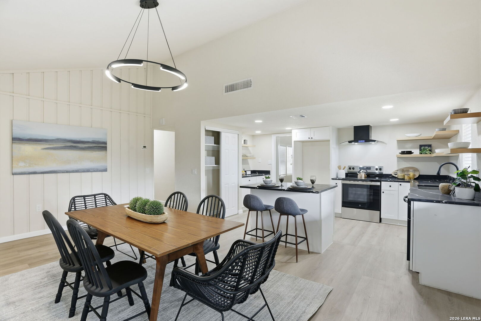 13403 Centerbrook Universal City, TX 78148 - Photo 16 of 30 a view of a dining room with furniture and wooden floor