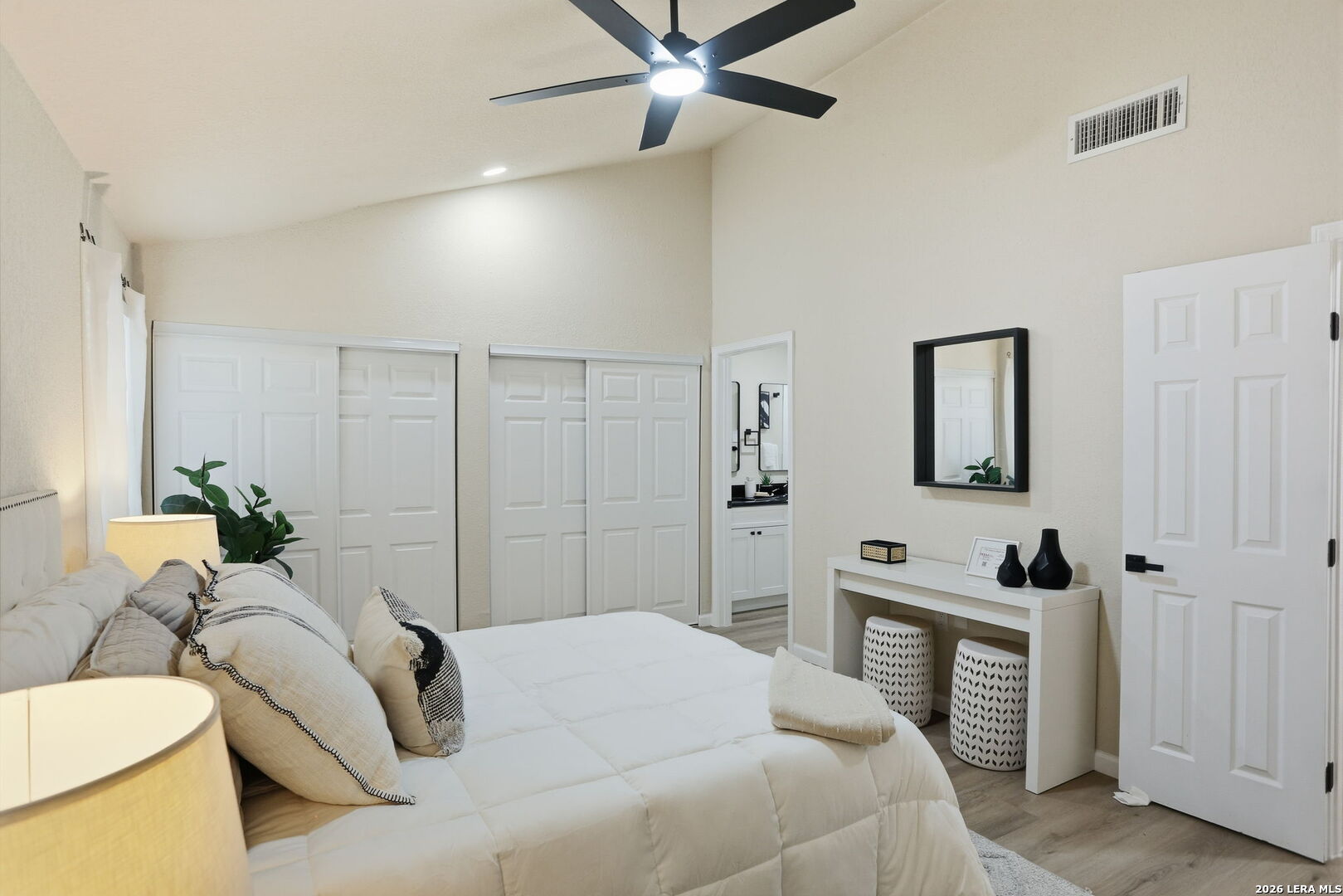 13403 Centerbrook Universal City, TX 78148 - Photo 18 of 30 a bedroom with a bed and a chandelier