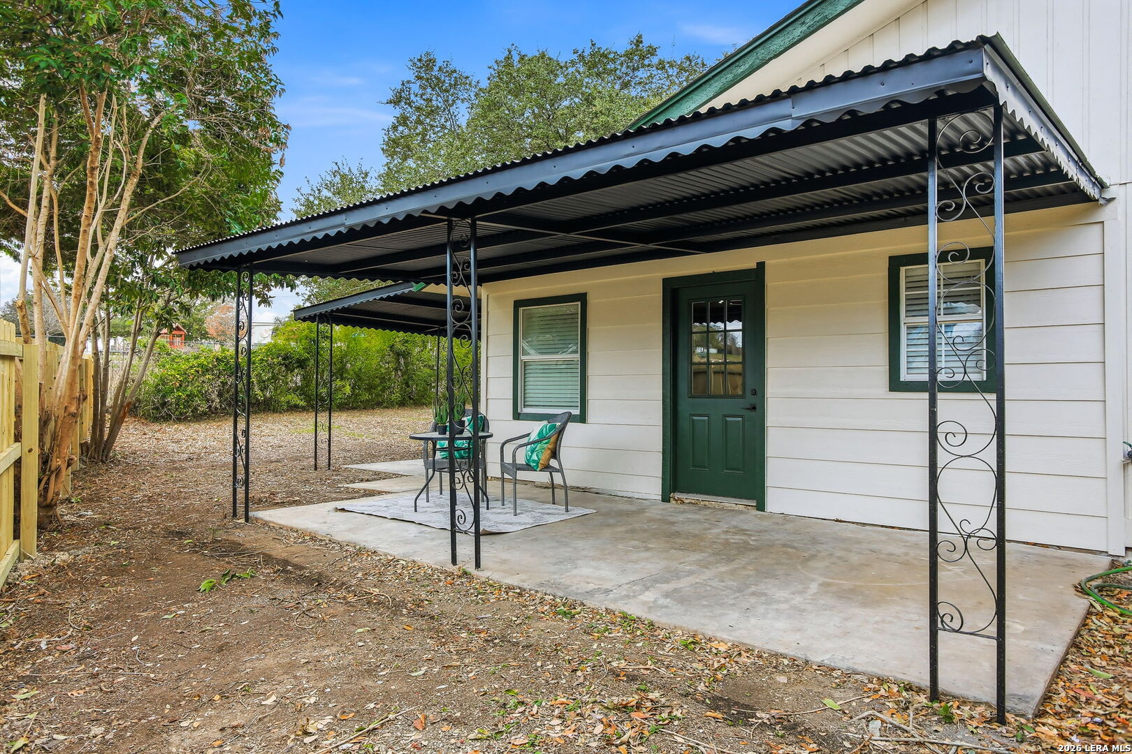 13403 Centerbrook Universal City, TX 78148 - Photo 26 of 30 a view of a porch with a table and chairs under an umbrella