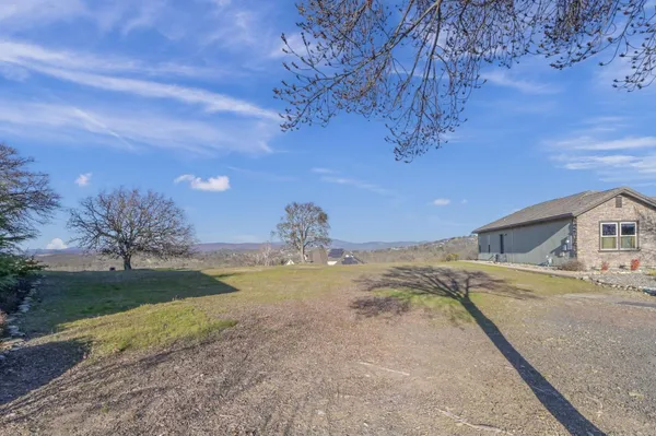a view of a backyard of a house