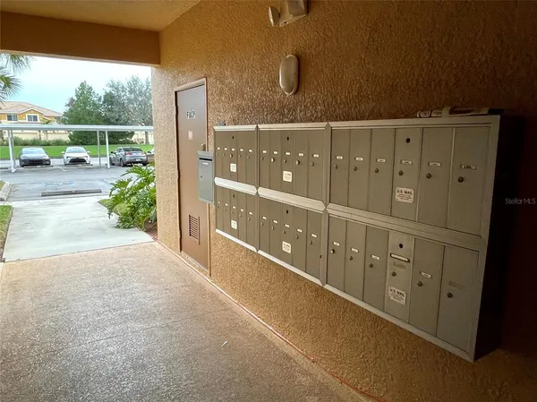 a view of a hallway with wooden door