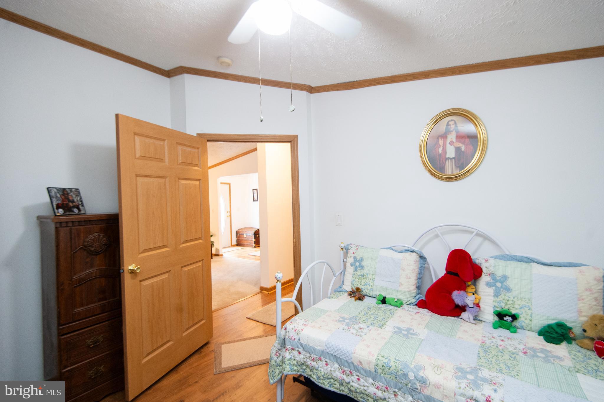 5622 Ross Neck Road Cambridge, MD 21613 - Photo 29 of 42 a bedroom with a bed and a closet
