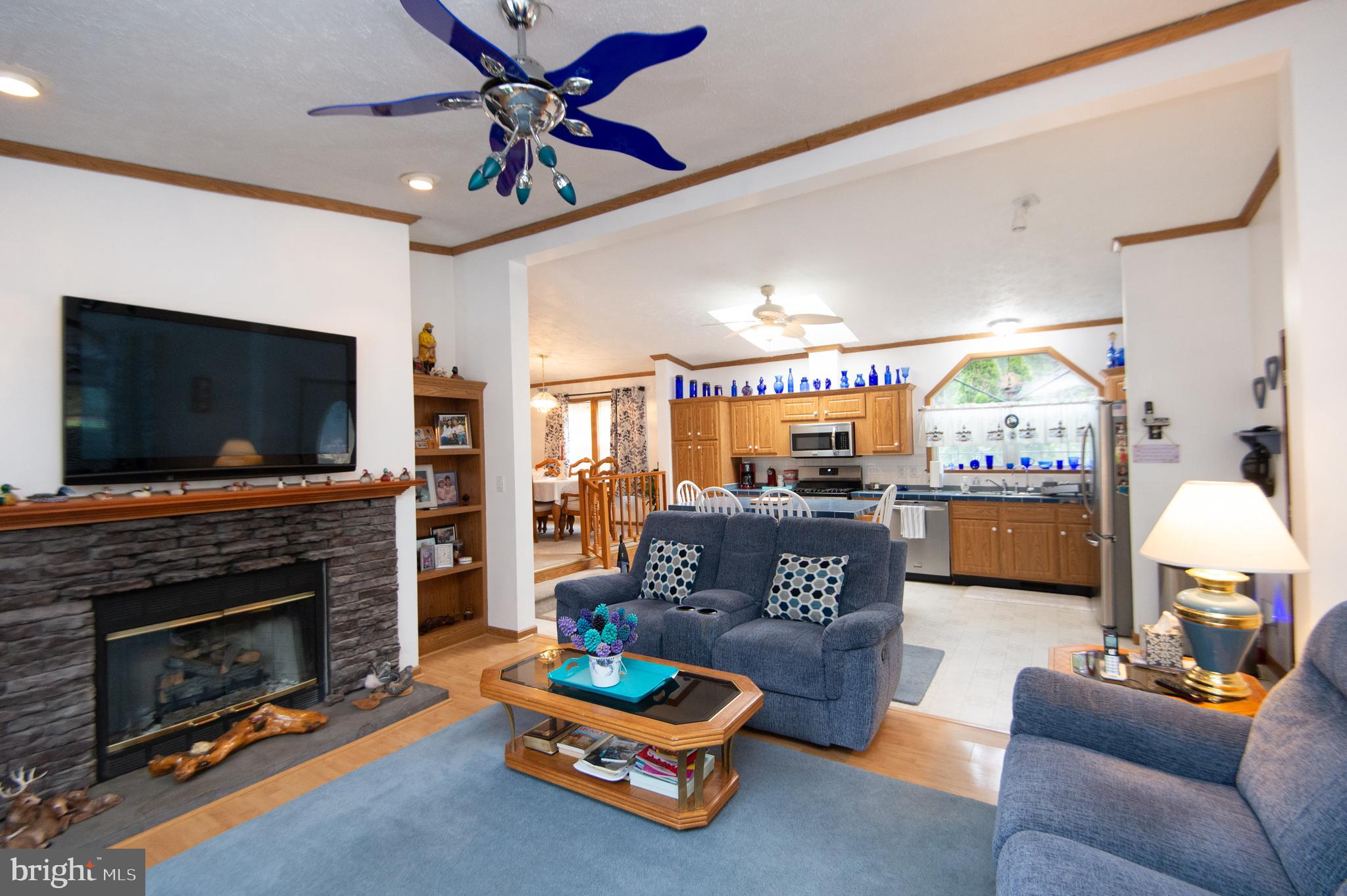 5622 Ross Neck Road Cambridge, MD 21613 - Photo 6 of 42 a living room with fireplace furniture and a flat screen tv