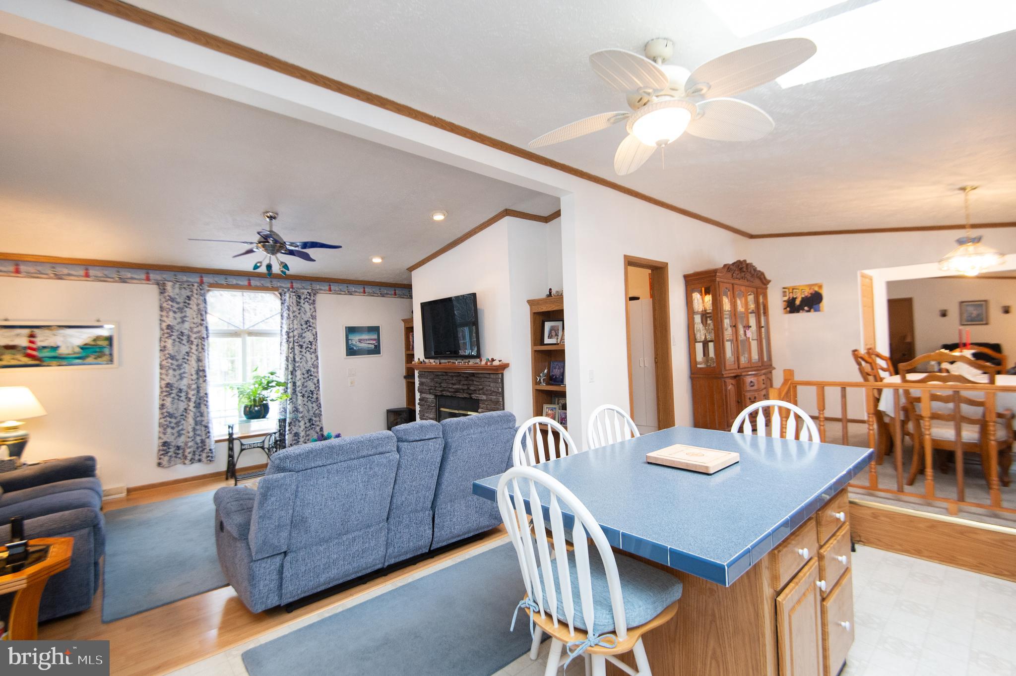 5622 Ross Neck Road Cambridge, MD 21613 - Photo 7 of 42 a view of a a dining room with furniture window and wooden floor
