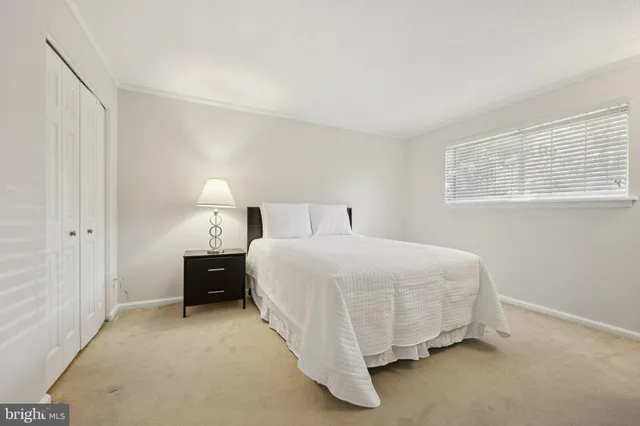 a bedroom with a bed and a cabinets