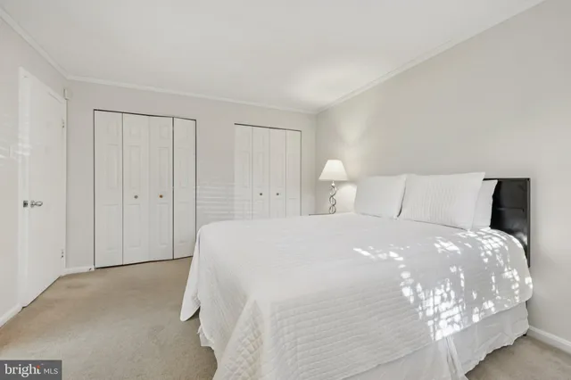 a large bed sitting in a bedroom and closet