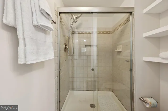 a bathroom with a shower and a tub