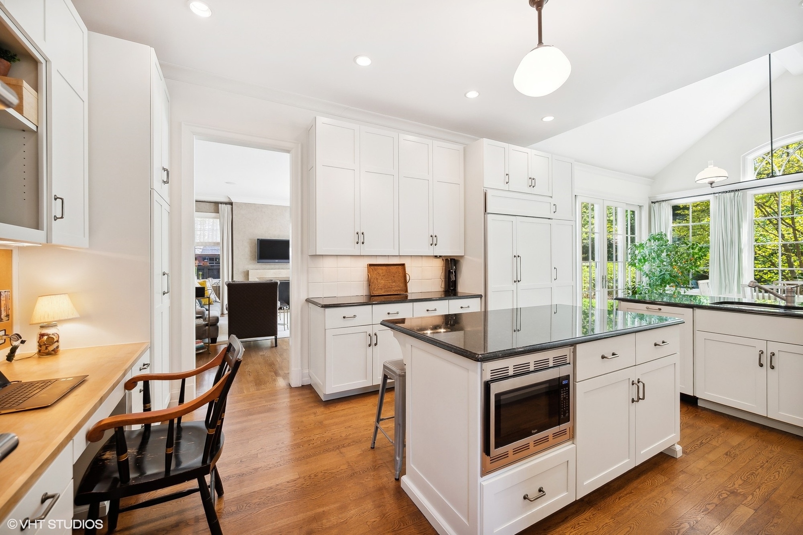 1024 Westmoor Road Winnetka, IL 60093 - Photo 11 of 38 a kitchen with stainless steel appliances kitchen island granite countertop a stove a sink and a refrigerator
