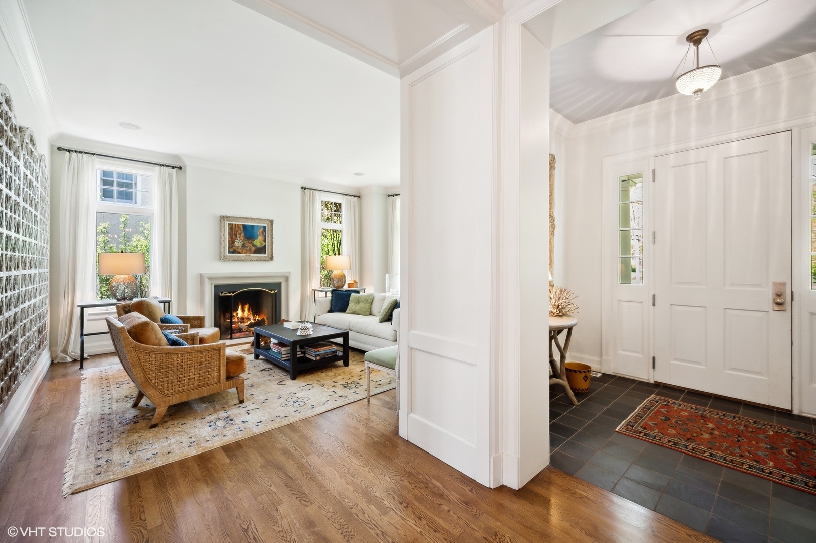 1024 Westmoor Road Winnetka, IL 60093 - Photo 2 of 38 a living room with furniture a fireplace and a table
