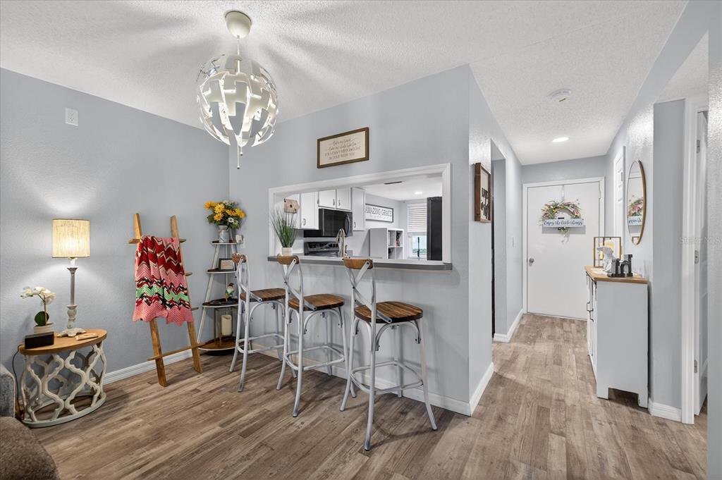 3230 Teeside Drive New Port Richey, FL 34655 - Photo 5 of 32 a view of a dining room with furniture and wooden floor