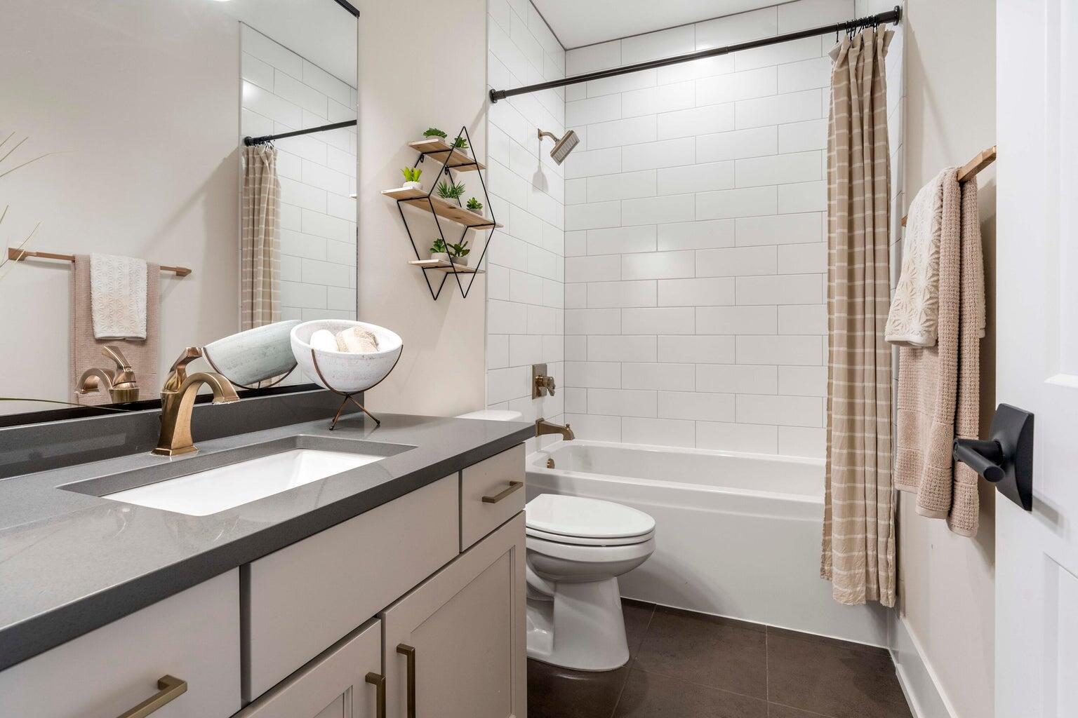 10883 Walnut Drive St. John, IN 46373 - Photo 13 of 30 a bathroom with a granite countertop sink toilet and shower