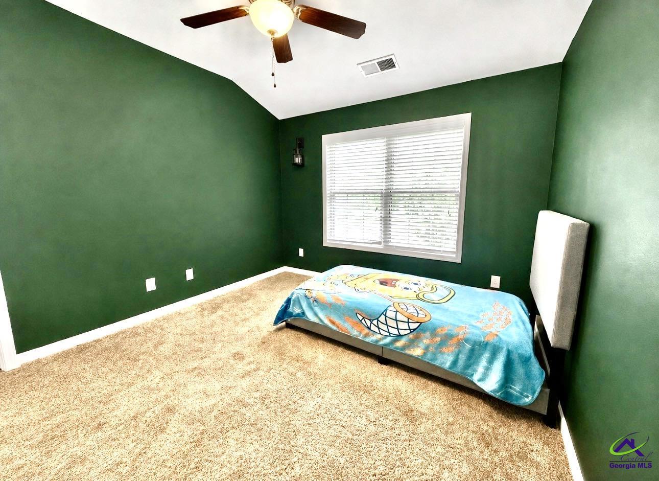 600 Post Oak Way Warner Robins, GA 31088 - Photo 39 of 50 a bedroom with a bed and a window