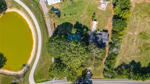 an aerial view of a residential apartment building with a yard