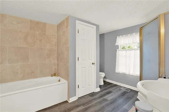 a bathroom with a bathtub and a sink