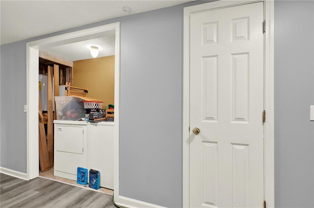2857 McDaniel Station Road Southwest Adairsville, GA 30103 - Photo 8 of 14 a kitchen with refrigerator and cabinets