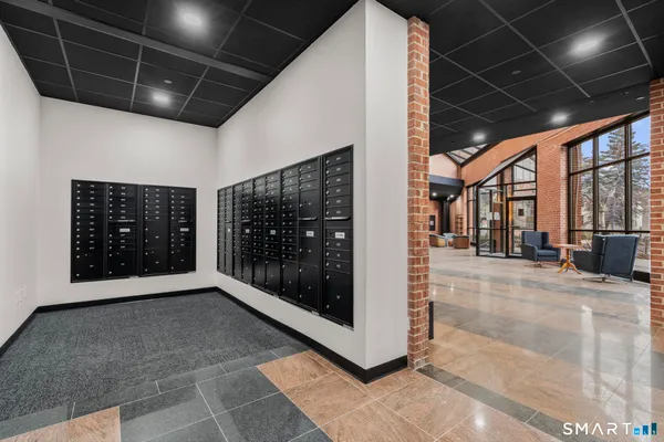 a bathroom with a sink toilet and a mirror