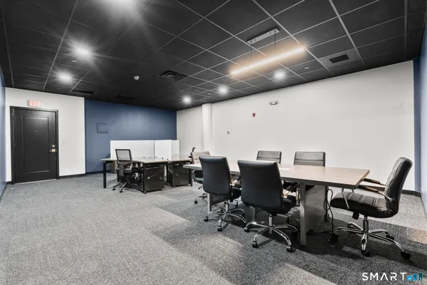 a room with furniture and air hockey table