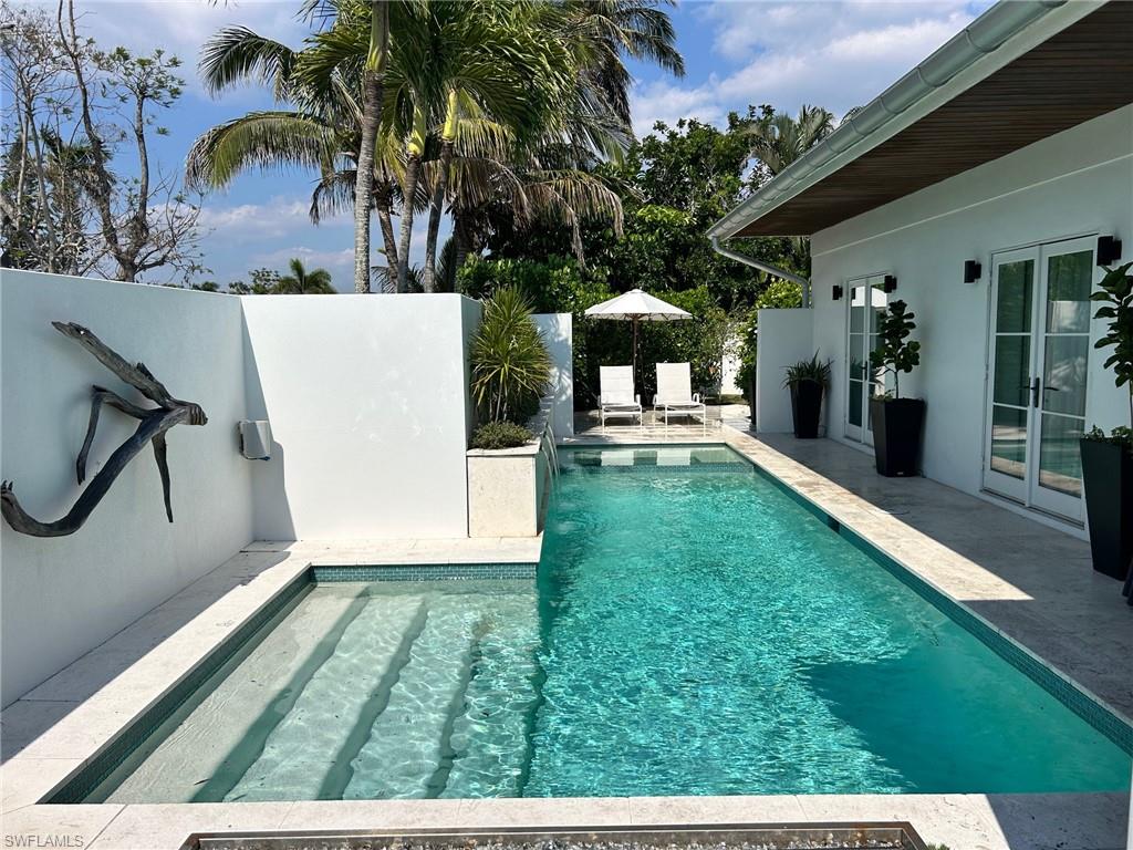 700 Rudder Road Naples, FL 34102 - Photo 3 of 34 Full enclosed cabana style lap Pool and hot tub