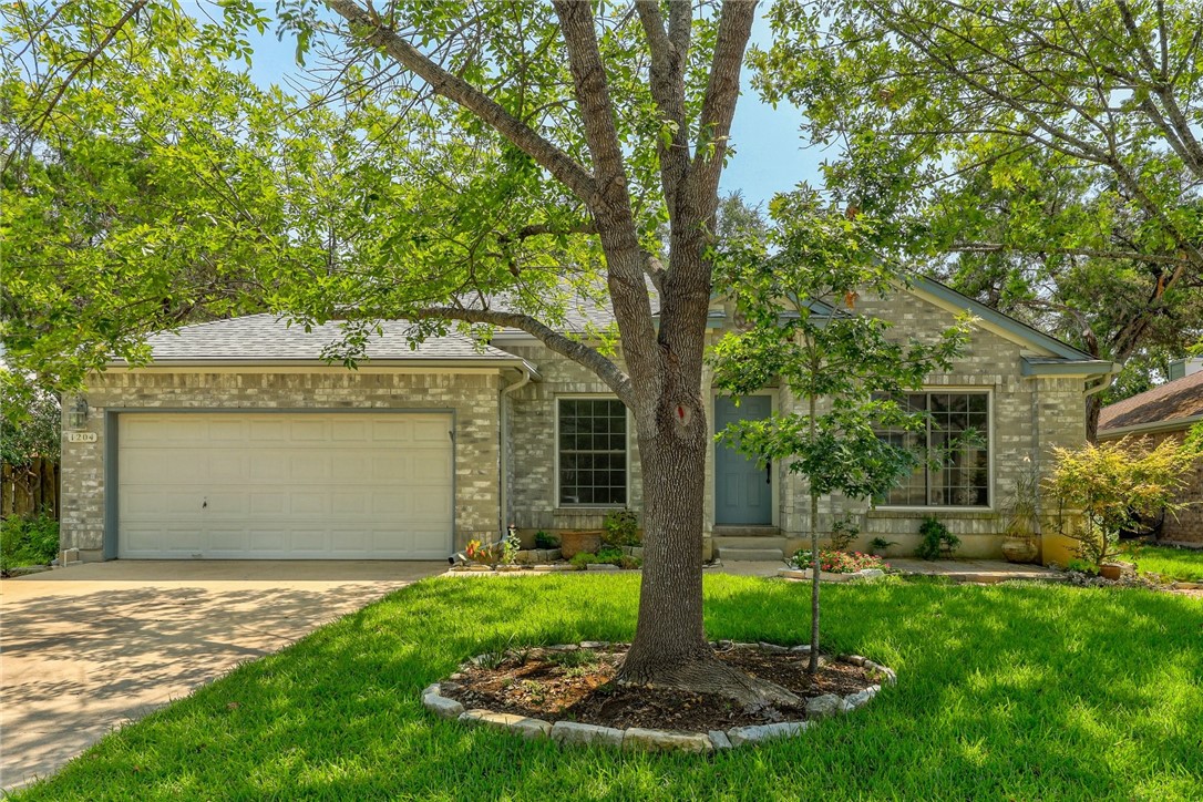 a front view of house with yard and green space
