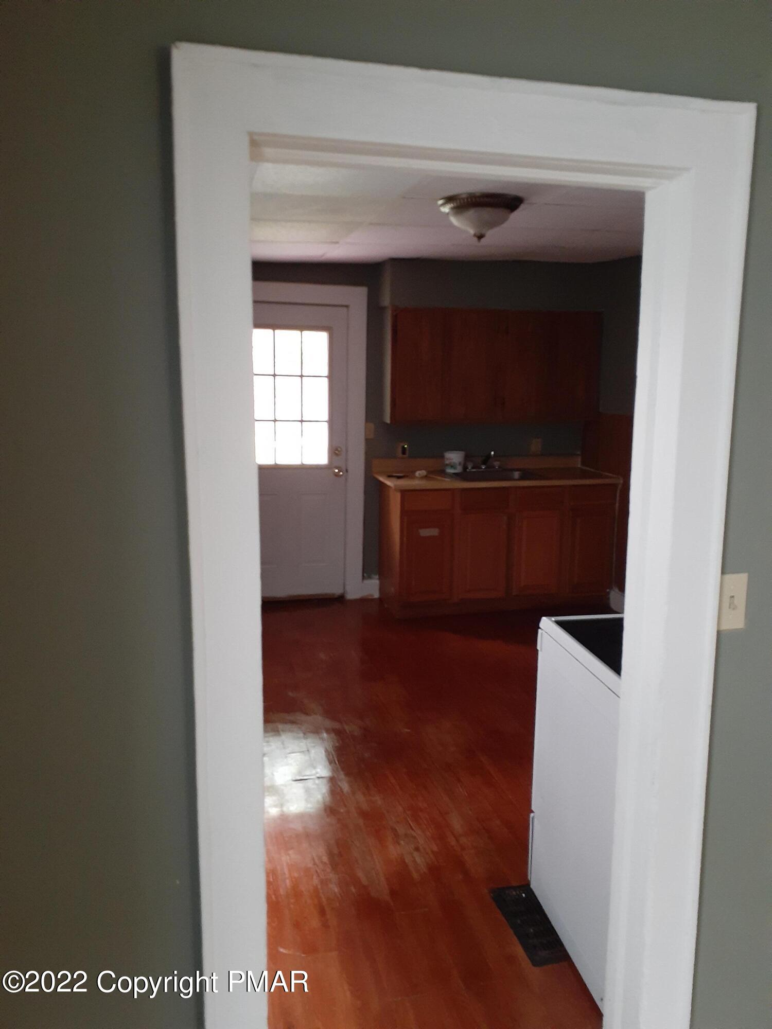 218 Ferdinand Street Scranton, PA 18508 - Photo 4 of 11 a view of hallway with wooden floor