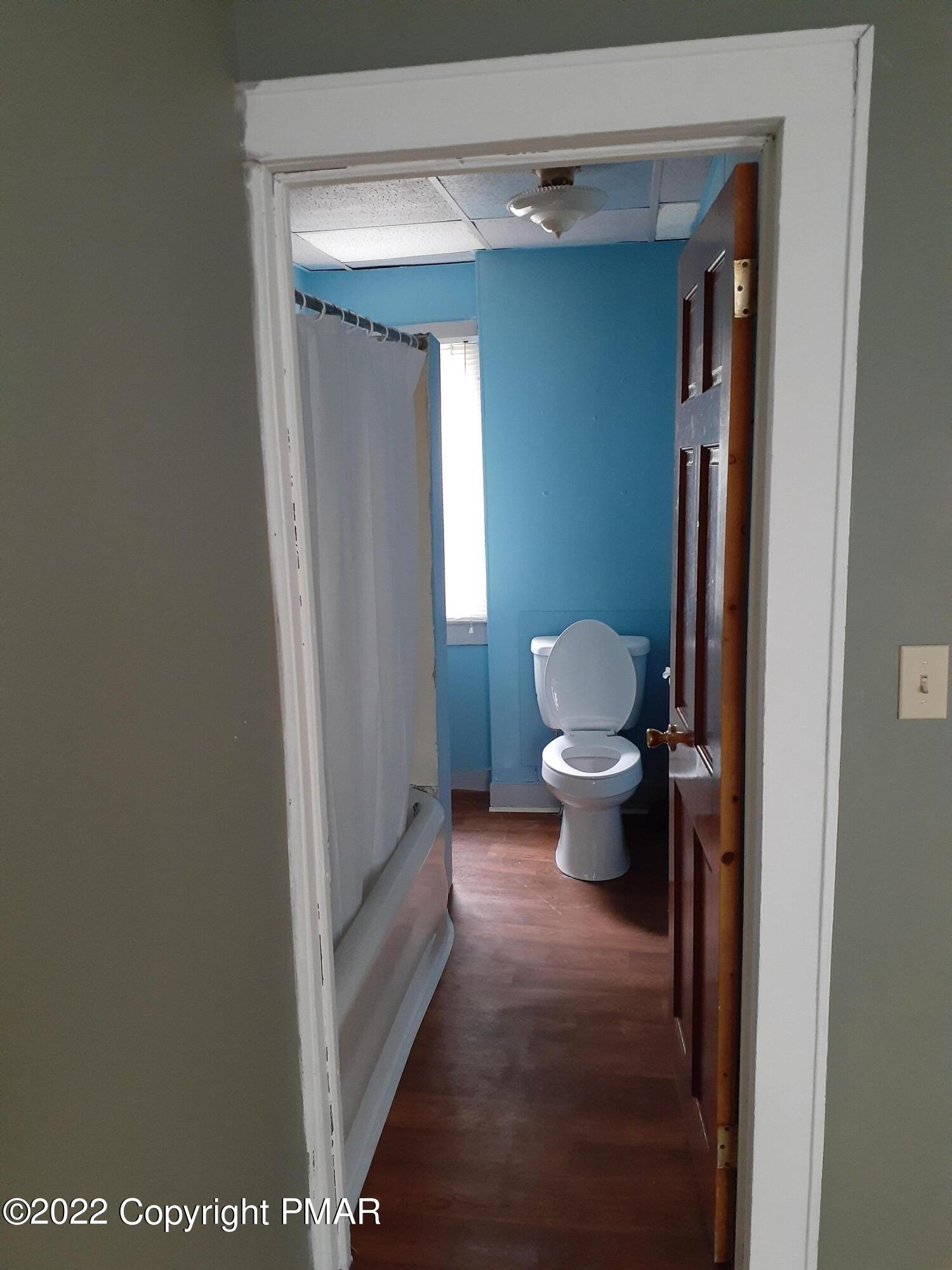 218 Ferdinand Street Scranton, PA 18508 - Photo 9 of 11 a bathroom with a toilet and a shower