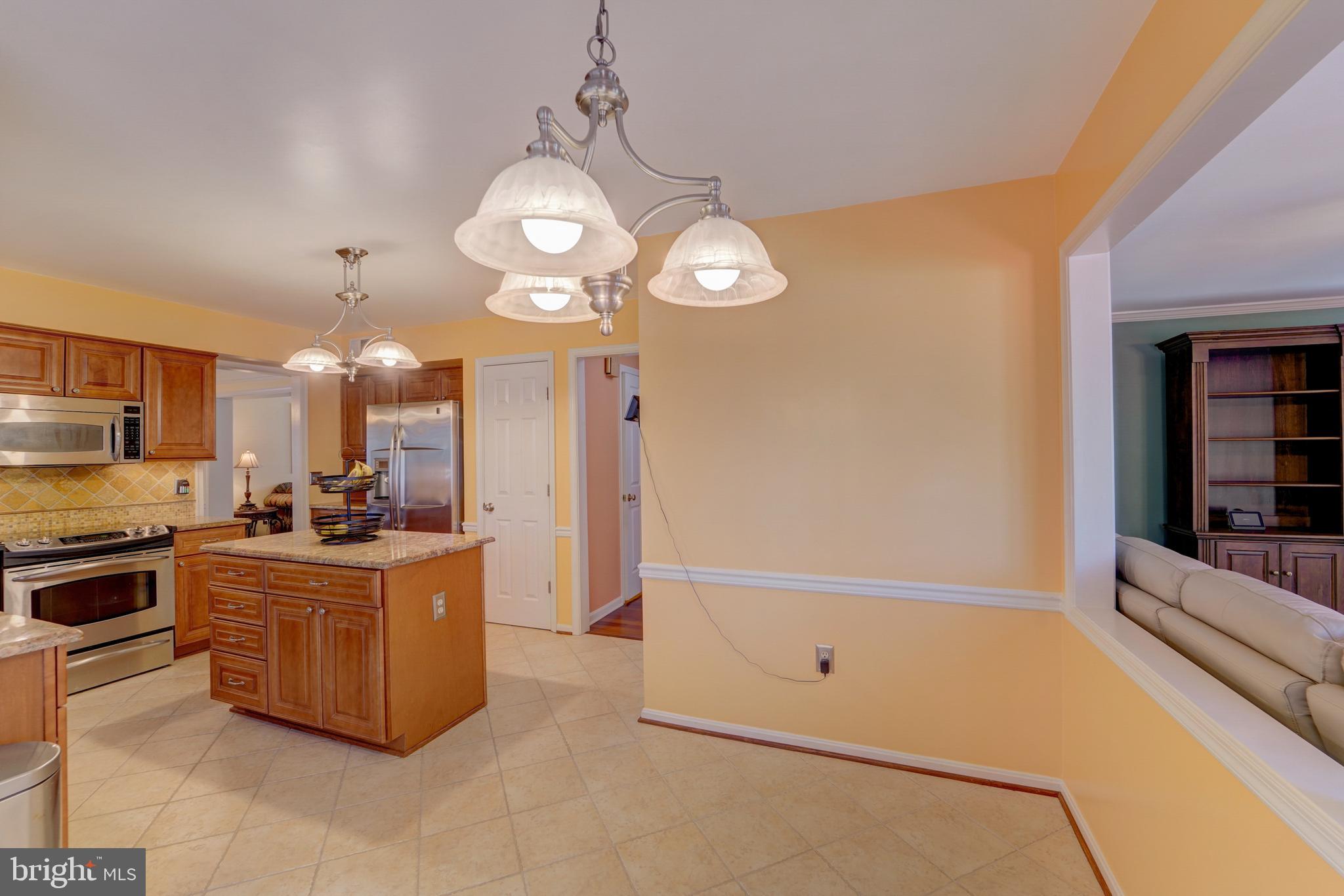 11604 Admiral Court Laurel, MD 20708 - Photo 14 of 46 shows that there is an eat in area in the kitchen