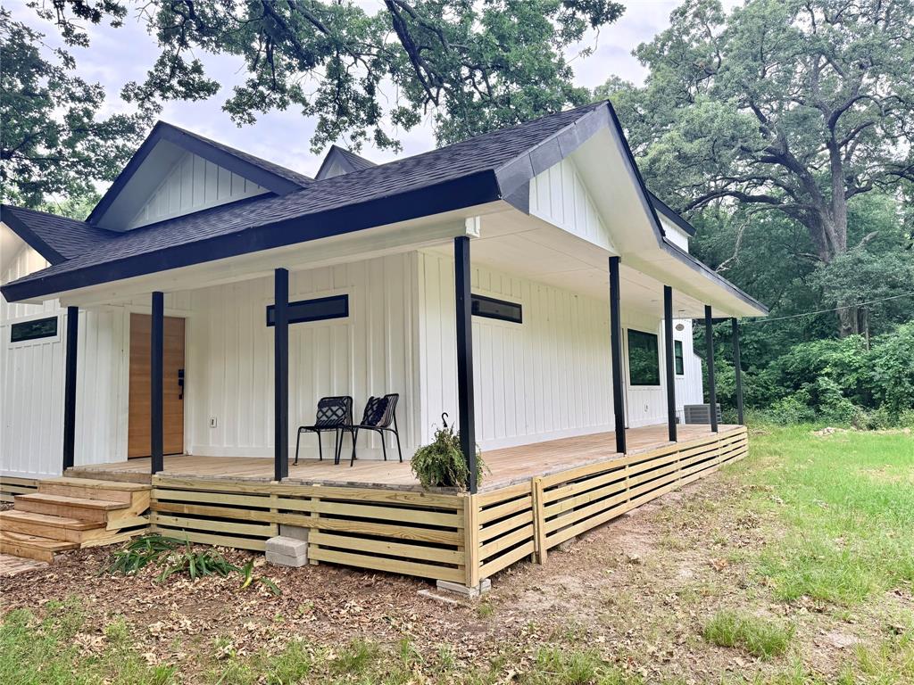 250 Skyview Point, TX 75472 - Photo 3 of 22 a front view of a house with a garden