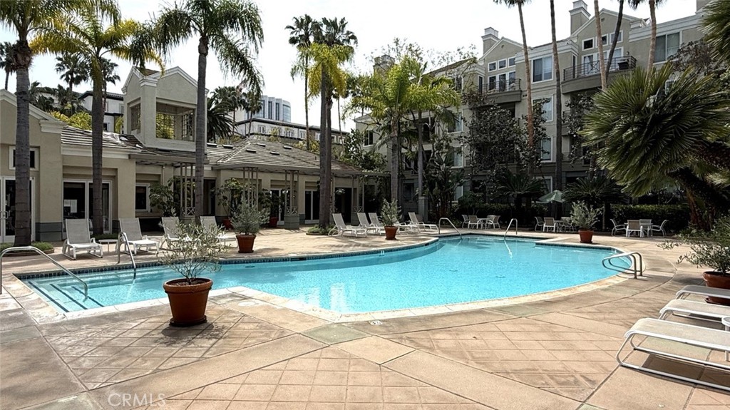 2253 Martin, Unit 107 Irvine, CA 92612 - Photo 13 of 17 a view of a swimming pool with a lounge chairs
