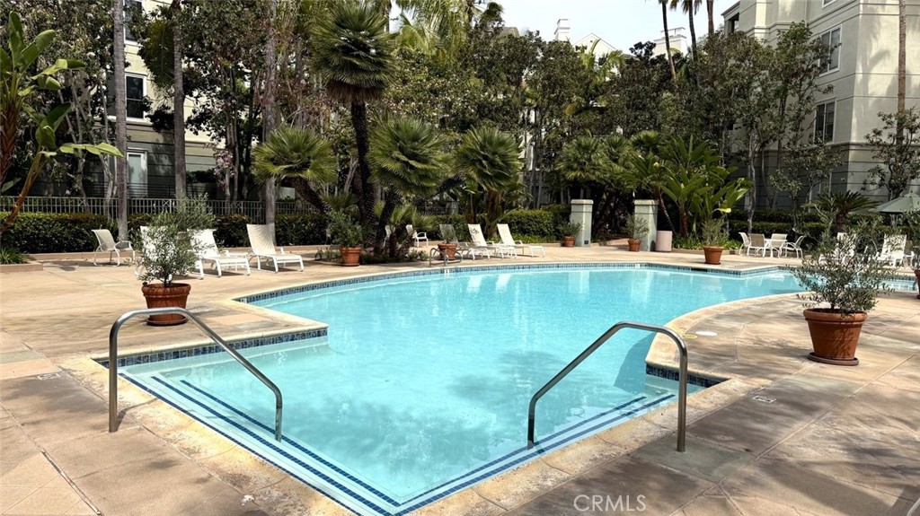 2253 Martin, Unit 107 Irvine, CA 92612 - Photo 15 of 17 a view of a swimming pool with chairs