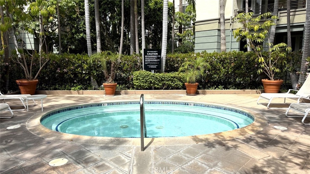 2253 Martin, Unit 107 Irvine, CA 92612 - Photo 16 of 17 a swimming pool with outdoor seating and yard