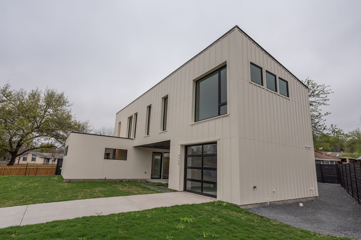 4906 Aberdeen Circle Austin, TX 78745 - Photo 1 of 28 a view of backyard with large tree and wooden fence