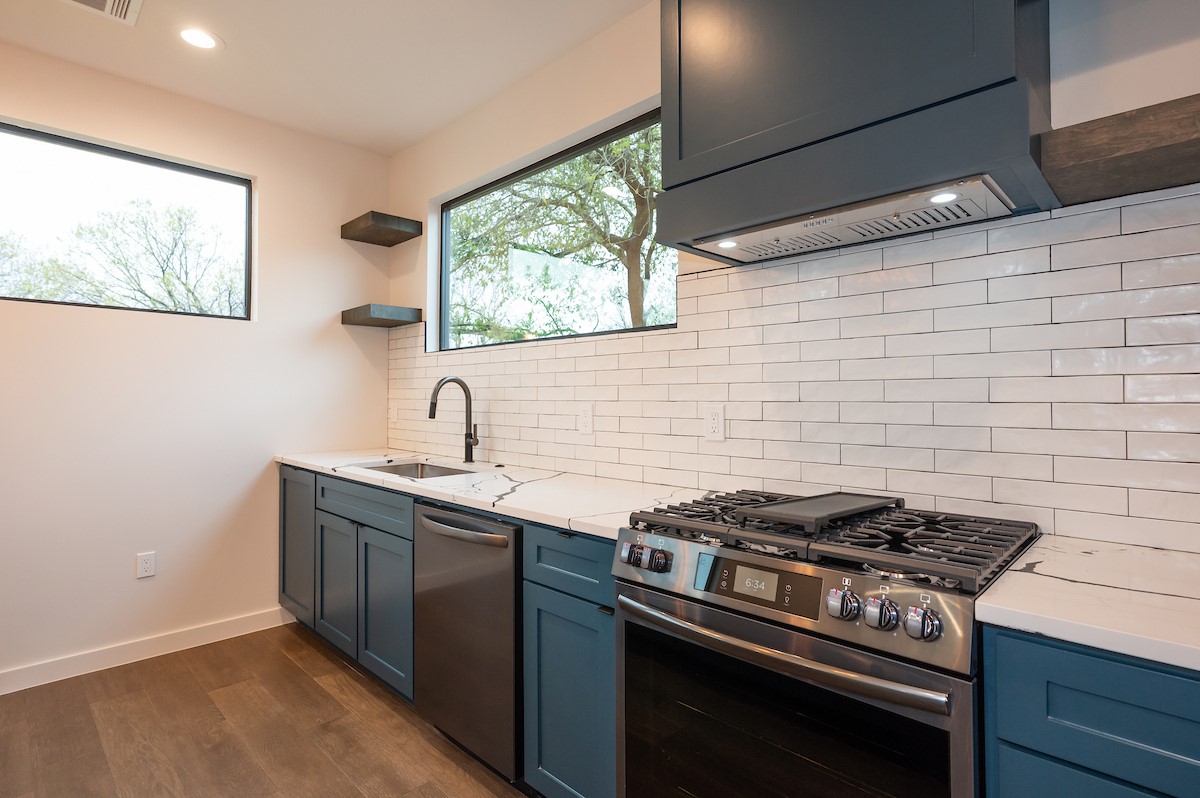 4906 Aberdeen Circle Austin, TX 78745 - Photo 12 of 28 a stove top oven sitting inside of a kitchen