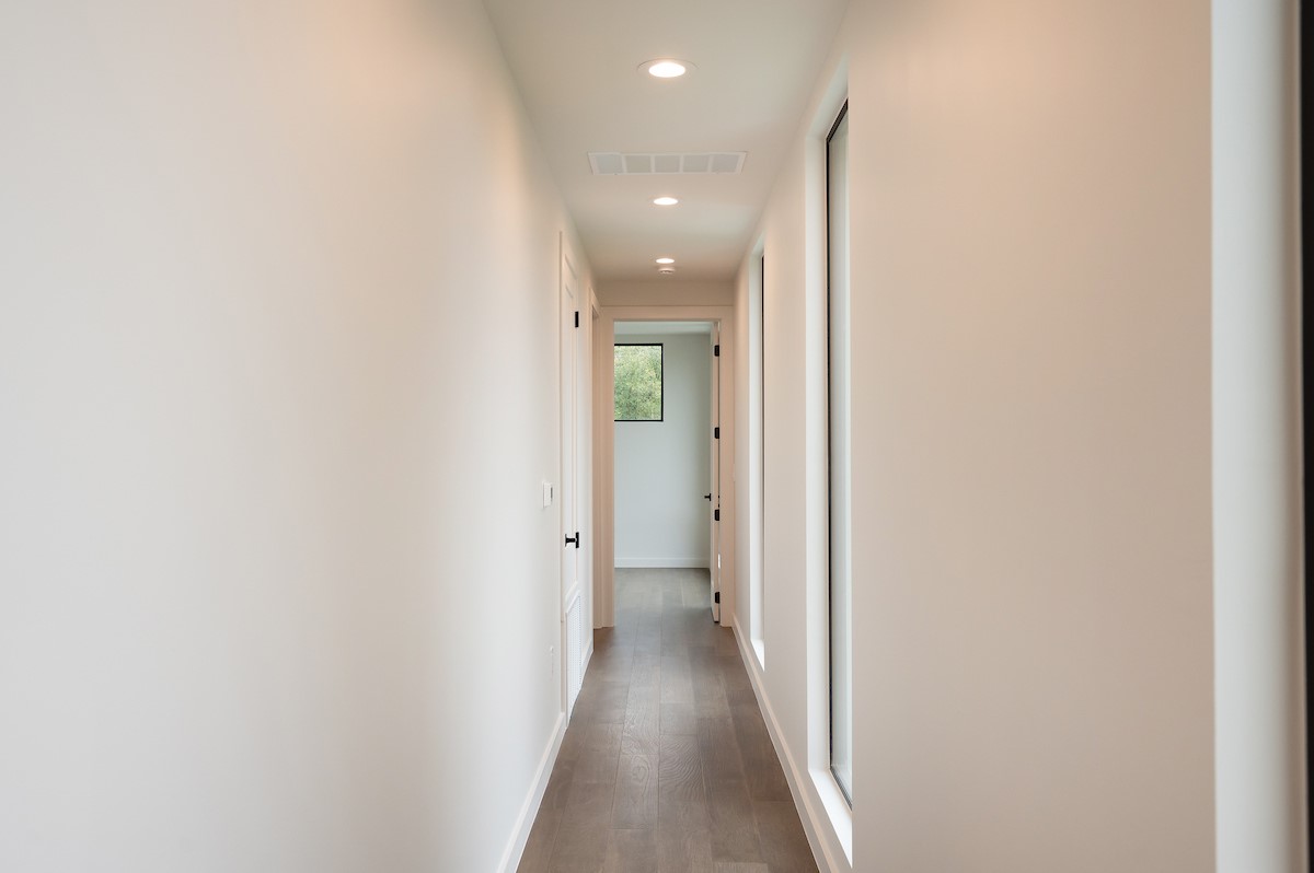 4906 Aberdeen Circle Austin, TX 78745 - Photo 28 of 28 a view of a hallway with wooden floor