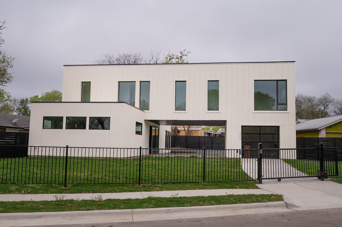4906 Aberdeen Circle Austin, TX 78745 - Photo 3 of 28 a view of a house with a yard and plants