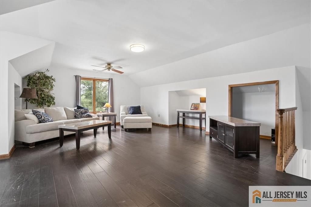 167 Federal Road Monroe Township, NJ 08831 - Photo 31 of 46 a living room with furniture and a wooden floor