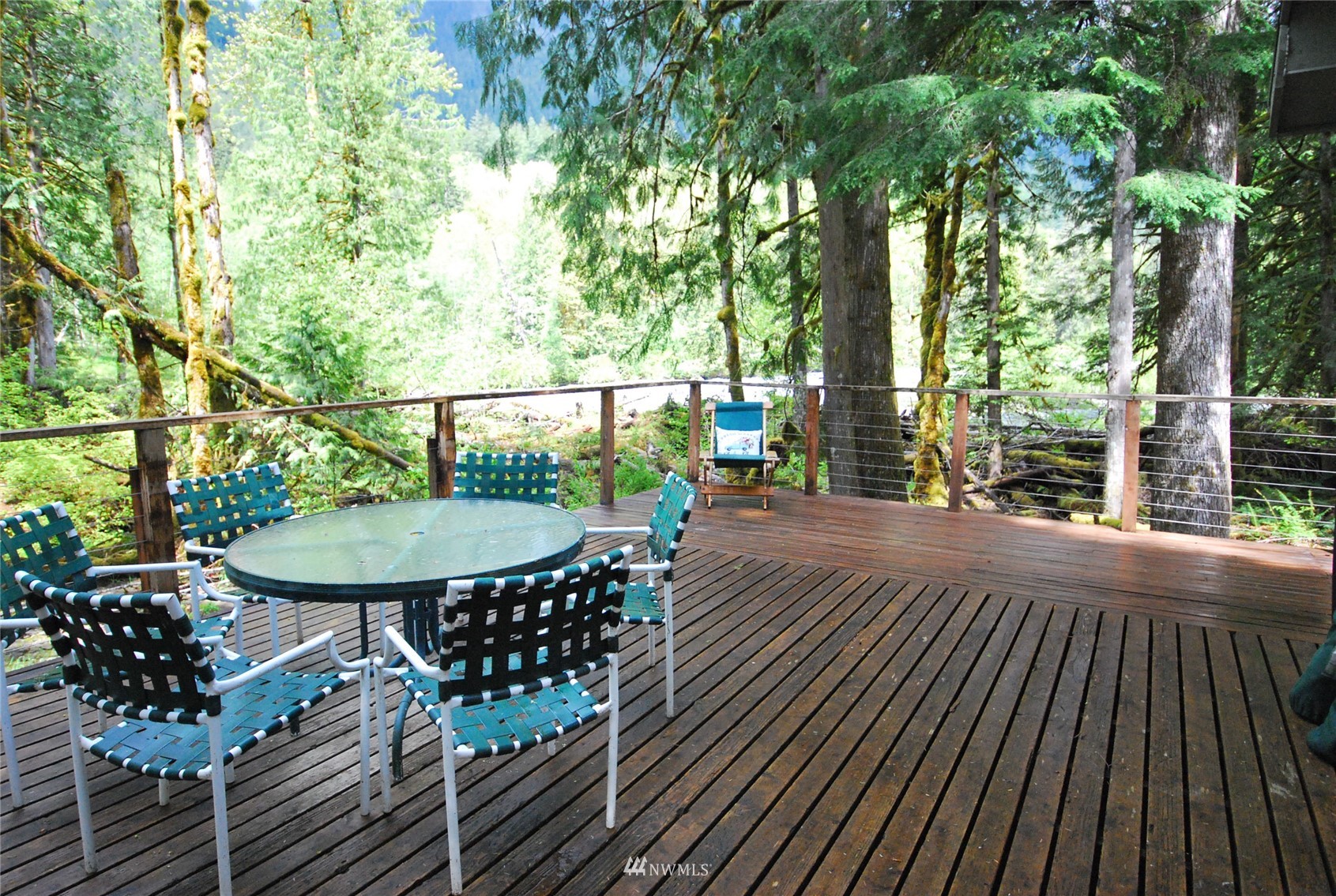 16128 Index-Galena Road Index, WA 98256 - Photo 5 of 35 a view of a balcony with chairs and wooden floor
